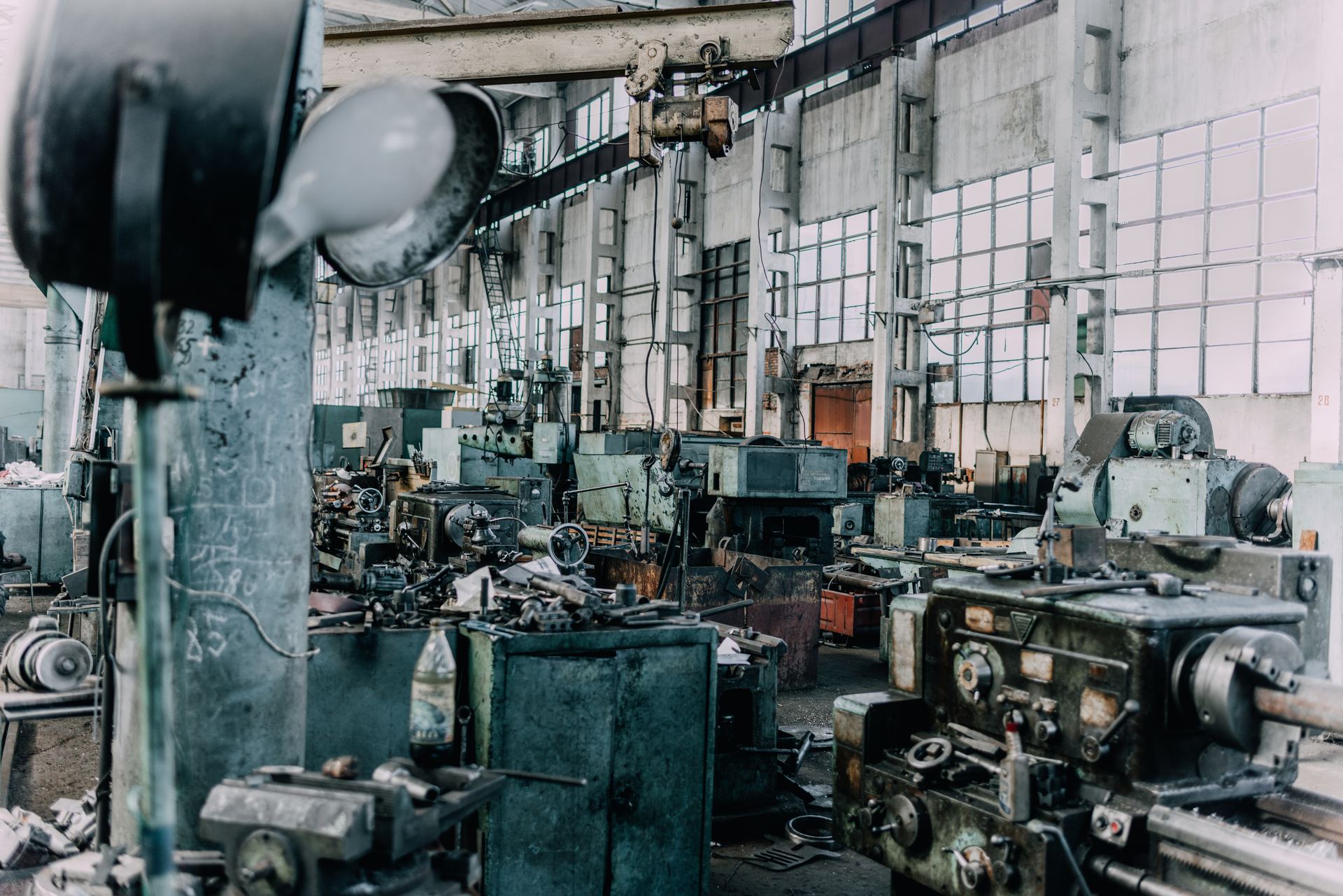 Old, worn industrial machinery in a dim mechanical space