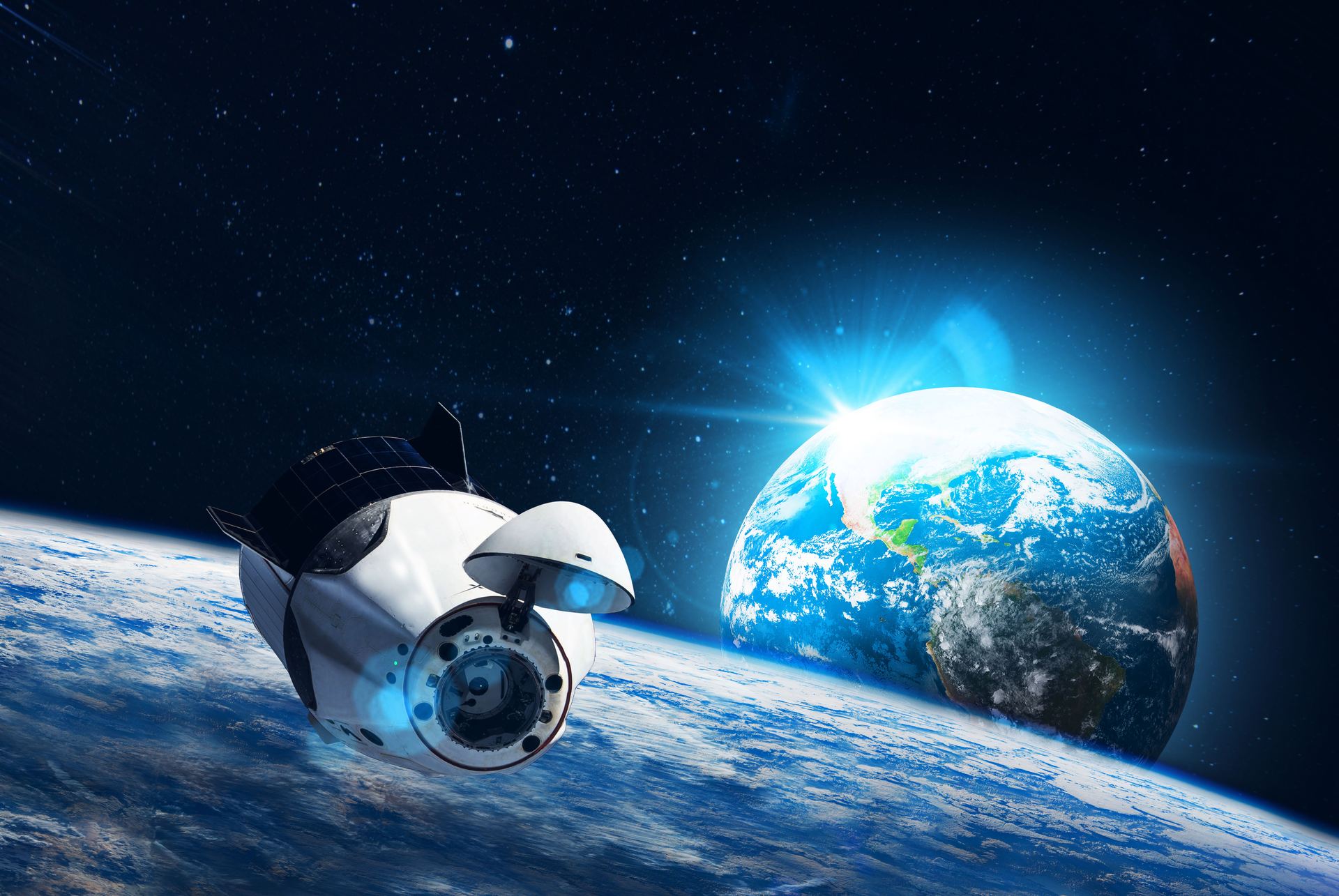 A space station orbiting a planet against the backdrop of the universe
